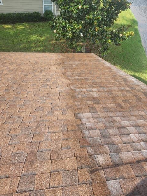 Tan shingle roof with the treated left side richer in color than the faded right side
